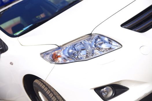 front view of modern white passenger car