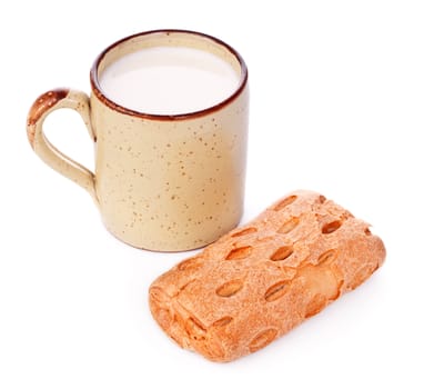 crispy bun and mug of milk isolated on white