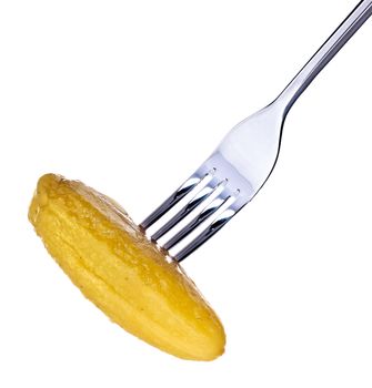 fresh pickle on fork isolated on white background