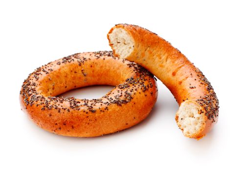 two bagels with poppy seeds isolated on white background