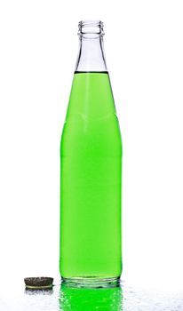 green soda bottle and ice cubes, white background