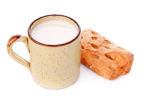 crispy bun and mug of milk isolated on white