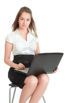 young businesswoman sitting on chair with laptop, isolated on white