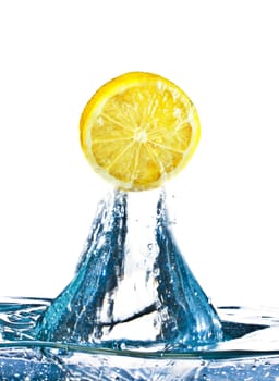 lemon is dropped into water splash isolated on white