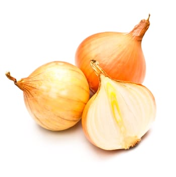 three yellow onions isolated on white background