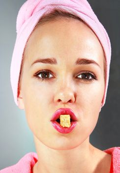 face of beautiful girl with piece of sweets