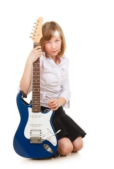 teen girl playing on a guitar, isolated on white