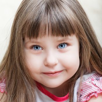 cute little blue-eyed girl portrait, close up