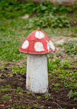 amanita mushroom decorative statue on green grass