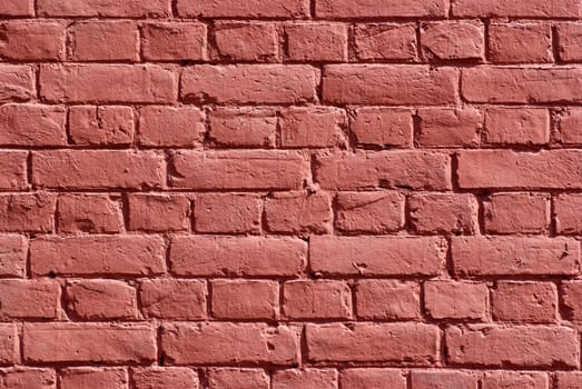 Texture of wall made of bricks painted red