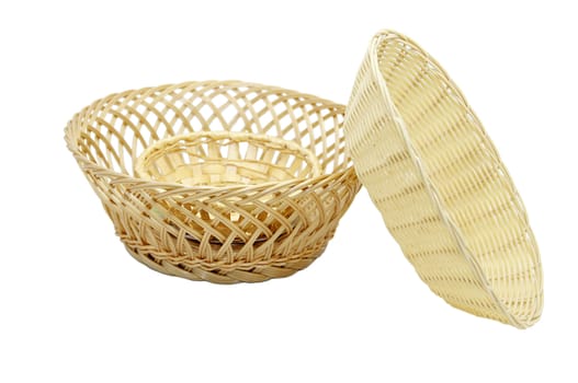 straw baskets of bread on a white background