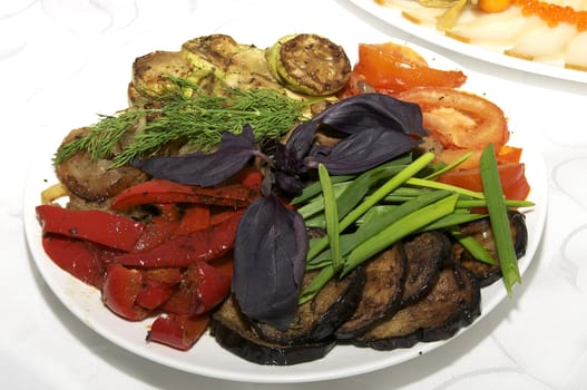 a plate of grilled vegetables on the holiday table