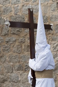 Easter nazarene in white robe in a typical Spanish procession. 