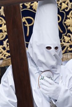 Easter nazarene in white robe in a typical Spanish procession. 