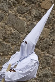 Easter nazarene in white robe in a typical Spanish procession. 