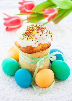 Easter cake and colorful eggs on festive Easter table