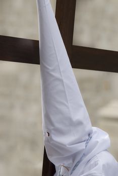 Easter nazarene in white robe in a typical Spanish procession. 