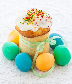 Easter cake and colorful eggs on festive Easter table