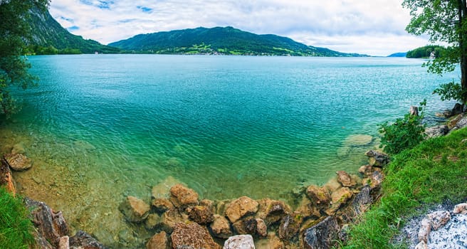 Panorama a blue transparent alpine lake. Salzkammergut. Austria