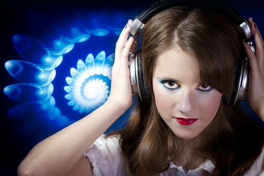Beautiful Girl listening music over blue abstract background
