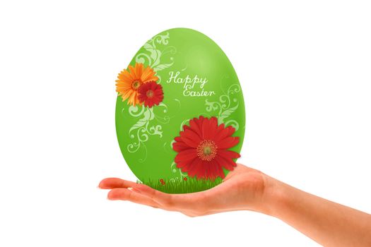 Hand holding a Green Easter Egg on white background.