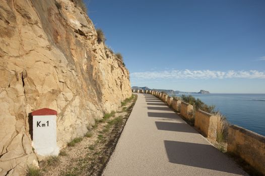 Scenic old coastal road winding over the Mediterranean