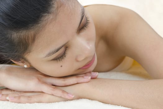 Beautiful Asian Girl having a back massage