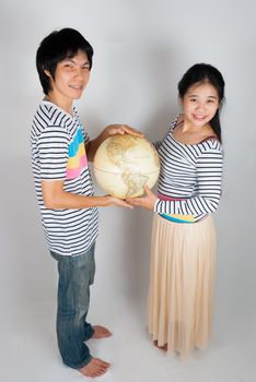Asian Thai spouse hold Globe by their hands