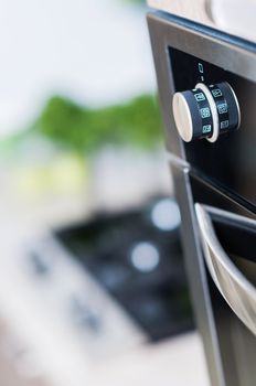 controls on the oven for a close-up. vertical view