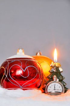 An image of New Year balls with candle