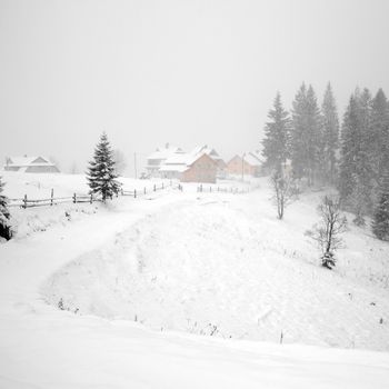 An image of a village in winter mountains