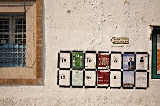 TUNIS, TUNISIA - OCTOBER 5: Black frames with numbers on the wall are places for election posters for more than 80 political parties which take part in a first election after Jasmin revolution on October 5, 2011 in Tunis. On October 23 Tunisians are set to vote for a constitutional assembly.