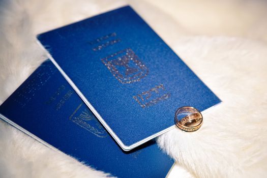 wedding rings and passports of Israel on boa