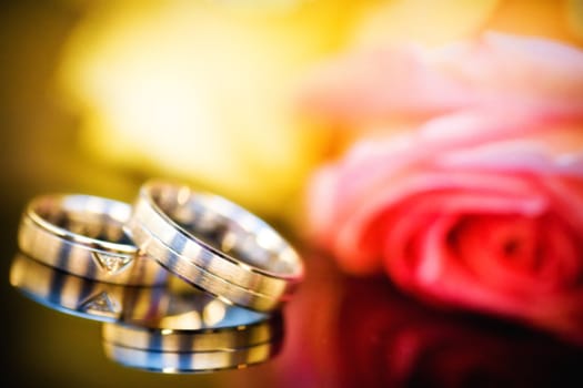 wedding rings with bouquet
