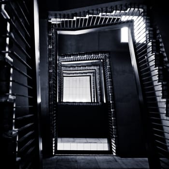 toned shot of abstract winding staircase