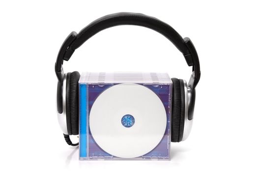headphones with stack of cds
