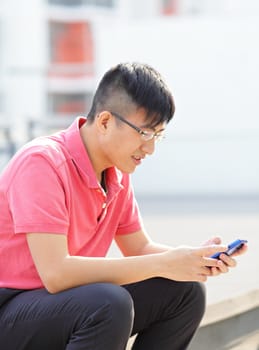 Man typing message on phone