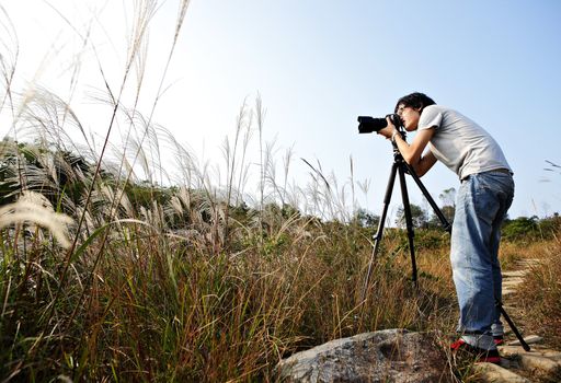 photographer taking photo in wild