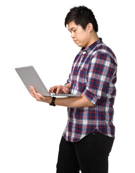 Young asian man using laptop computer