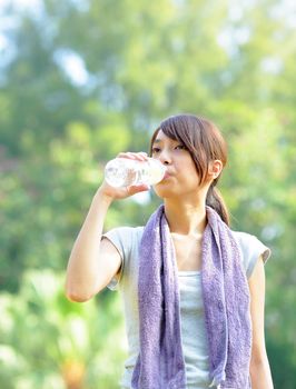 woman drink water after sport