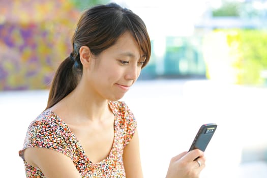 woman sms on mobile phone
