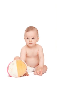 smiling baby sitting on the floor