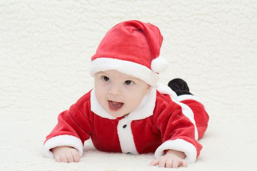 laughing baby in santa's suit