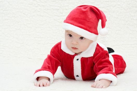laughing baby in santa's suit
