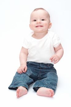 smiling baby sitting on the floor