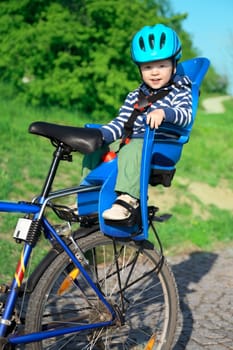 baby in bicycle chair