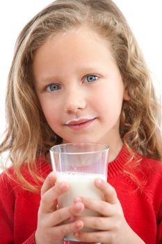 Close up Portrait of cute little girl holding glass of milk. Isolated on white background.