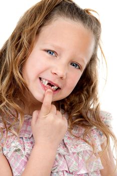 Close up Portrait of cute little girl showing her missing teeth. Isolated on white background.