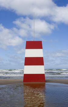 Red and White Landmark on the beach