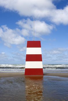 Red and White Landmark on the beach